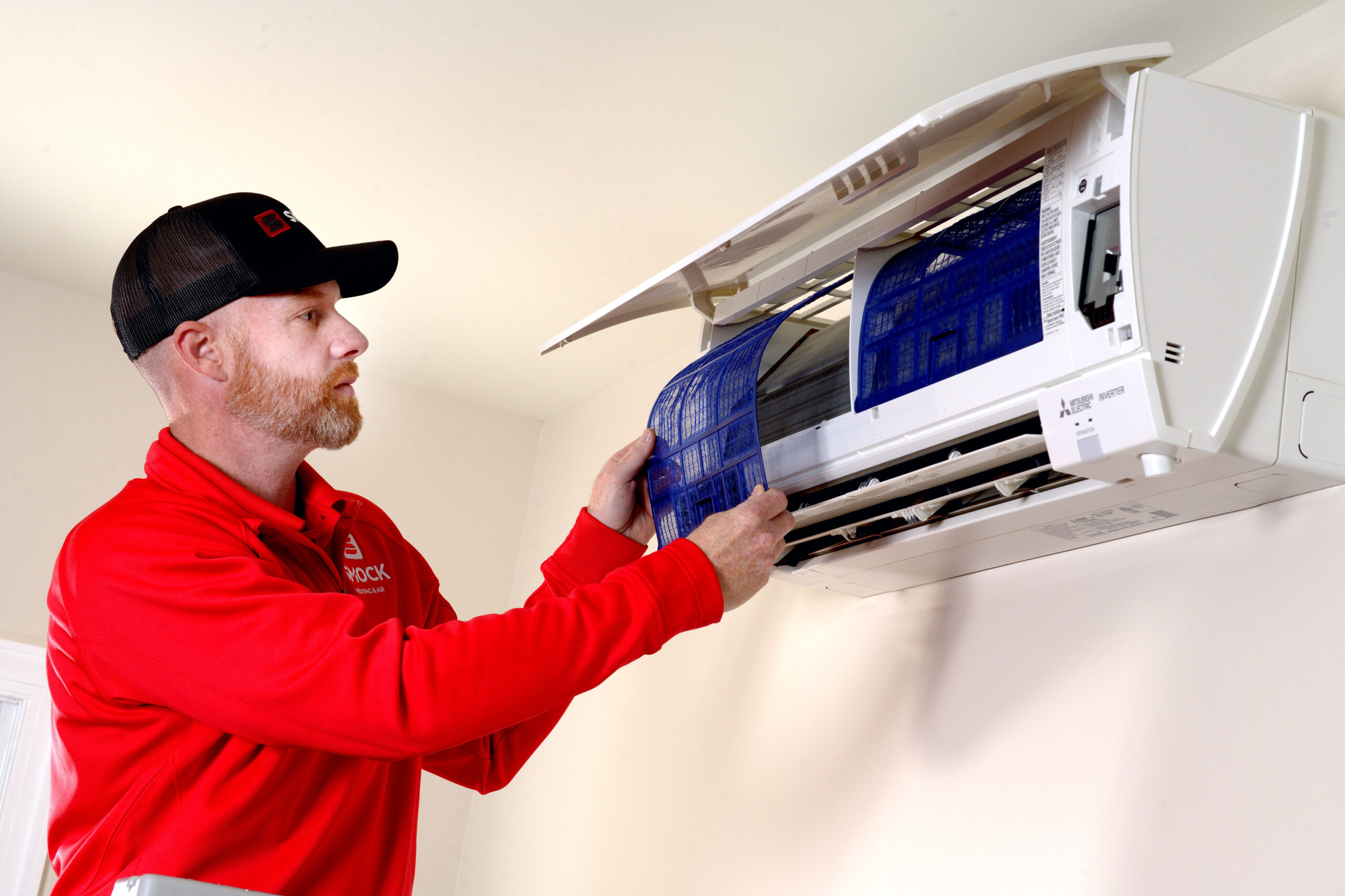 smock worker checking ac unit frederick county