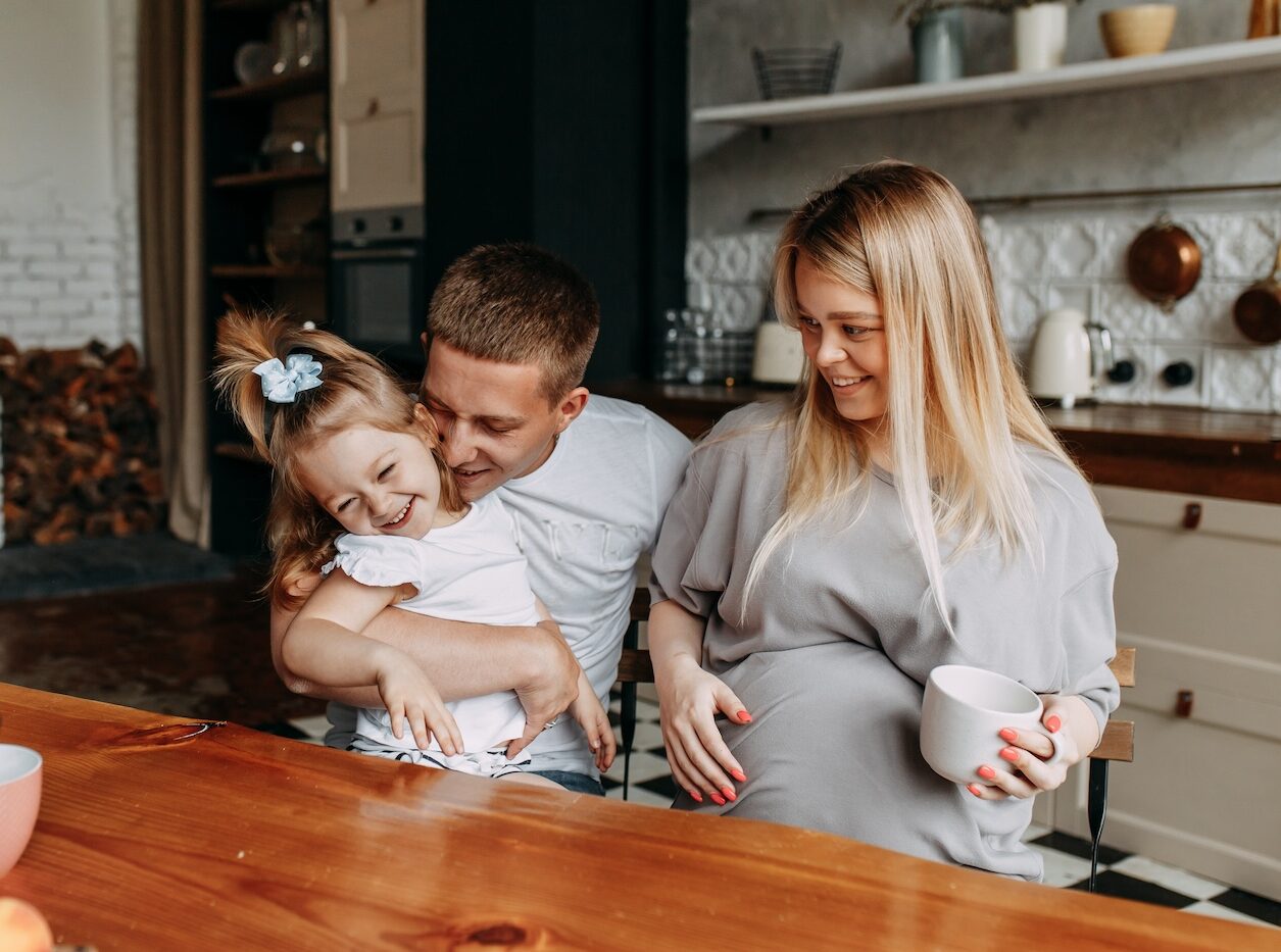 happy family laughing in the kitchen