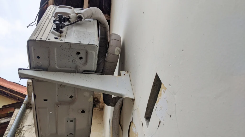 close up of air conditioning unit with ac drain line