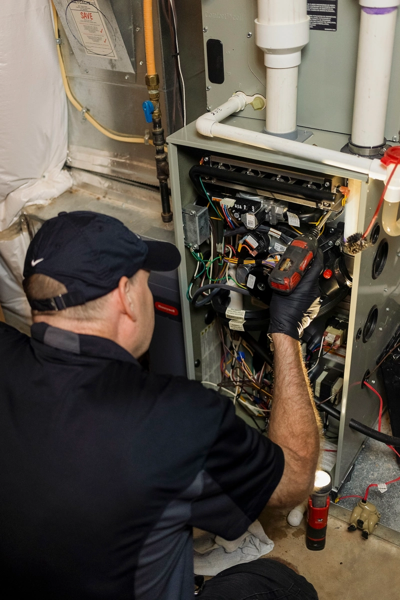 hvac contractor works on home furnace repair in monrovia md