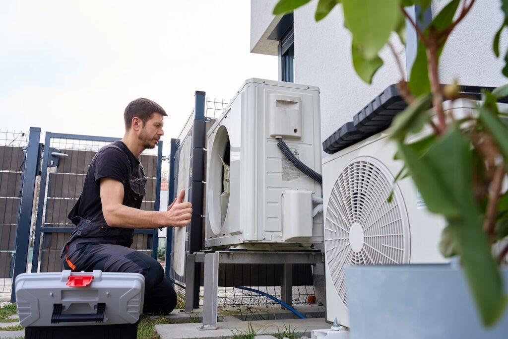 Technician performing maintenance hvac